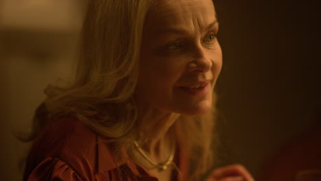 smiling senior woman enjoying romantic dinner