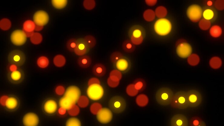 Bokeh di piccole piastre rotonde in movimento nei colori rosso, giallo e arancione