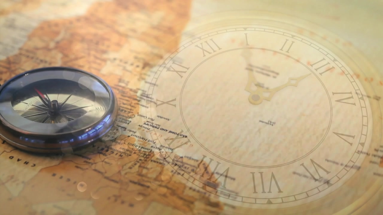 Camera zooming on compass on NW Africa map, panning right revealing clock, linking navigation time
