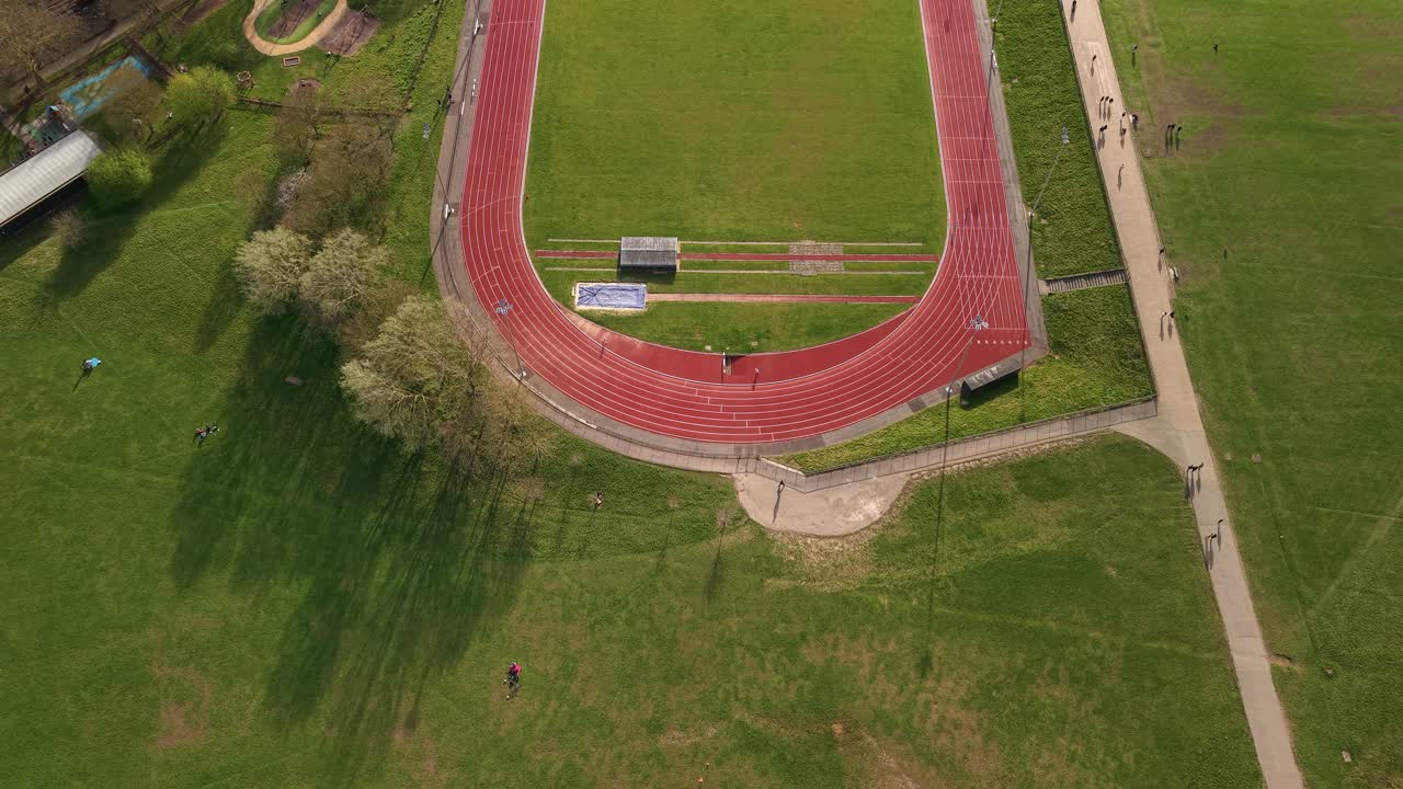 Aerial view looking down over Parliament hill red running track oval loop landmark in London