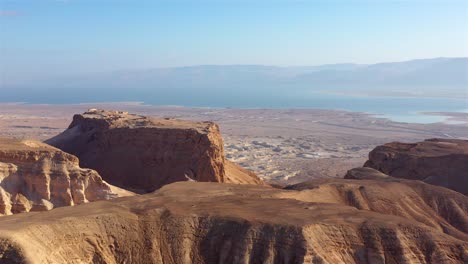 panoramic view of the dead sea and masada fortress in the judean desert