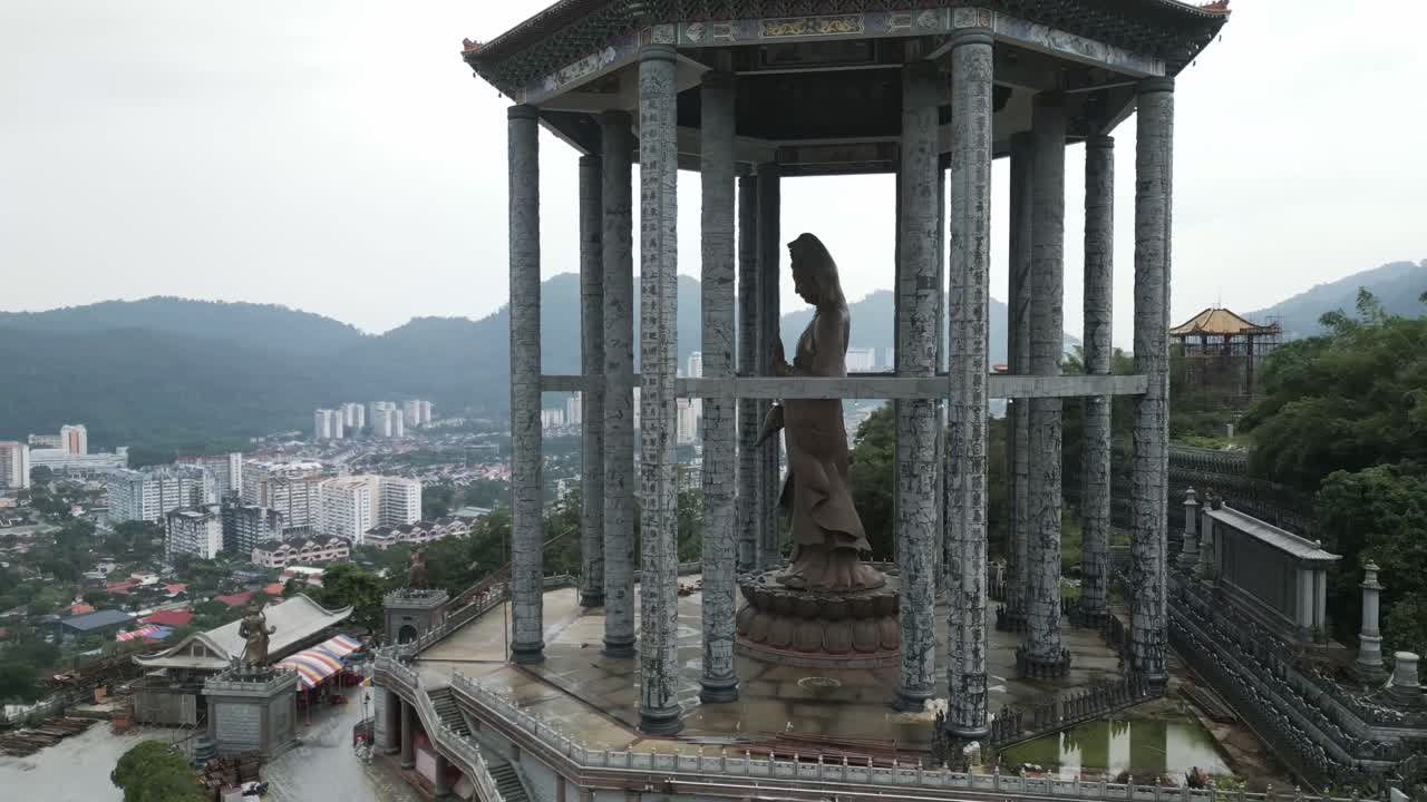 aerial drone close up of kek lok si temple Penang island Malaysia revealing George Town cityscape