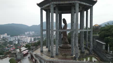 aerial drone close up of kek lok si temple penang island malaysia revealing george town cityscape