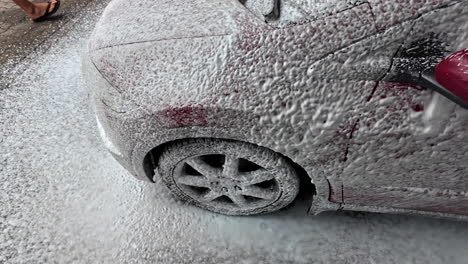 car wash covered in shampoo foam, cleaning of vehicle, valeting service