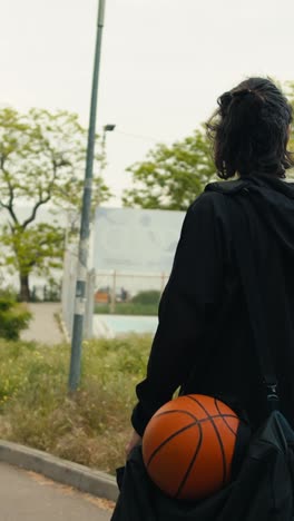 person with basketball