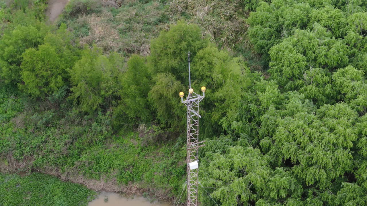 Aerial view of remote meteorological station in lush Argentine wetland forest