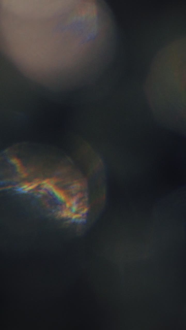 Dynamic Light Leaks and Bokeh Effect on Dark Background