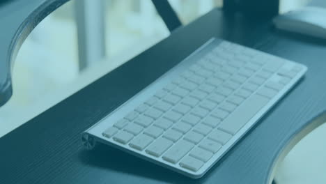 Animation of financial data processing over desk with computer in office