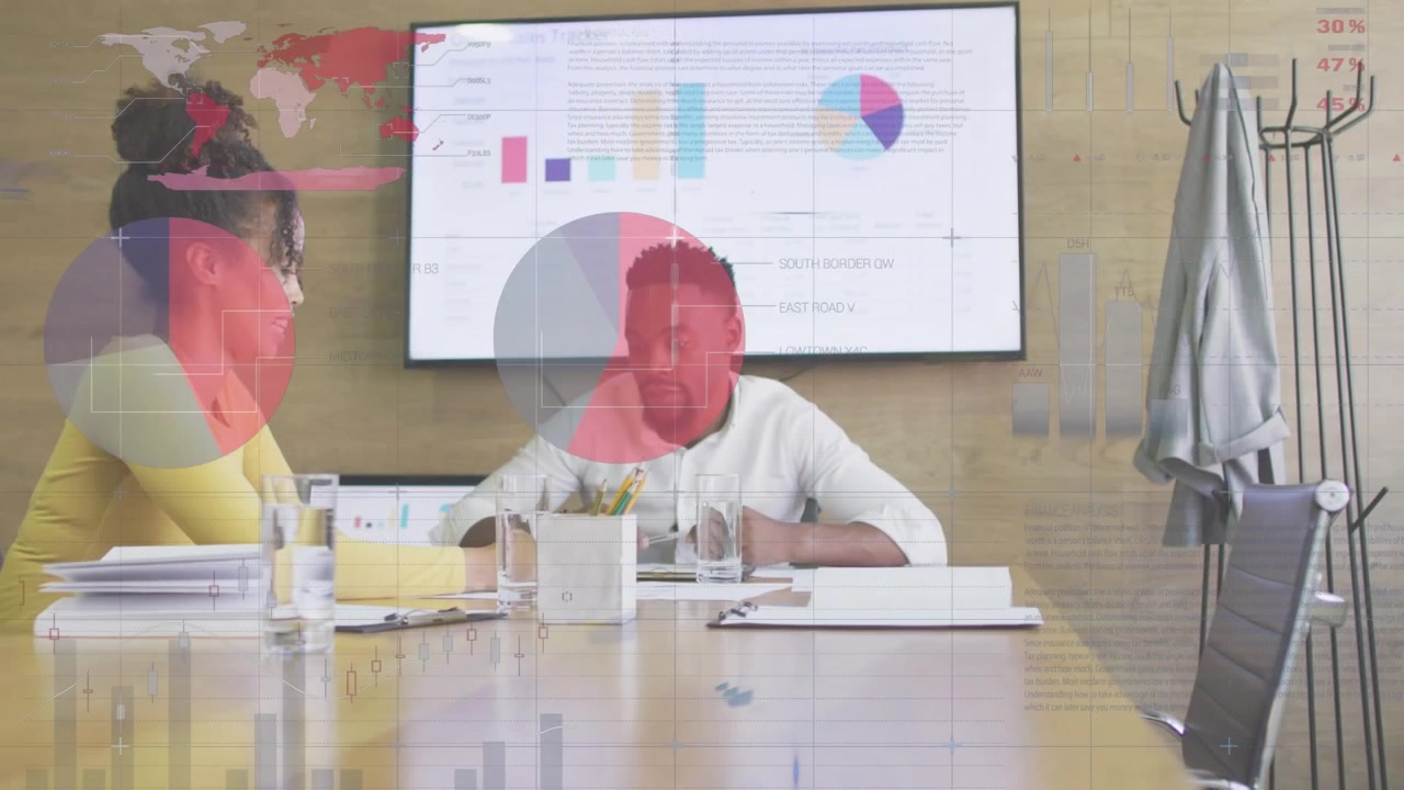 Business Colleagues Discussing Data in Modern Office Meeting