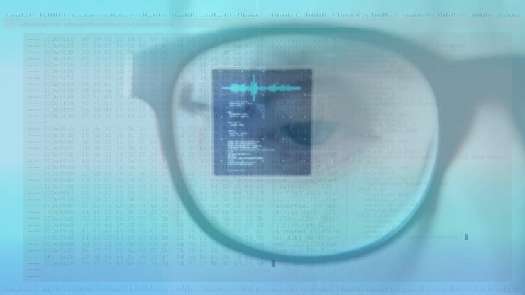 Animation af databehandling over en mands blå øje og briller