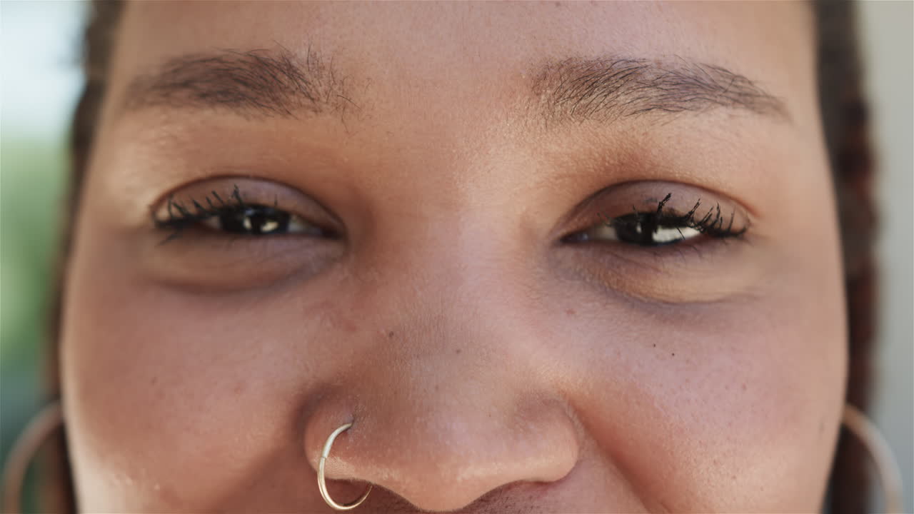 Close-up of a young biracial woman smiling
