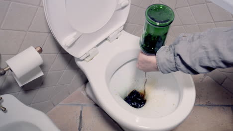 dropping the content of a whiskey bottle in the water closet and pulling the drain, getting free from alcoholism and bad habits