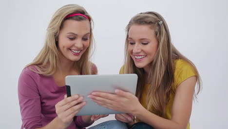 females friends using an ebook