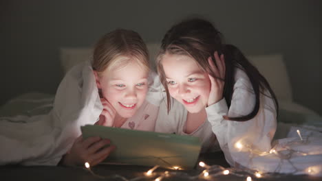 tablet, night and happy with children in bedroom