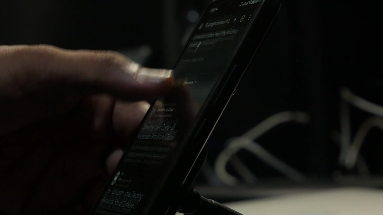 Close-Up of Finger Tapping Smartphone Screen