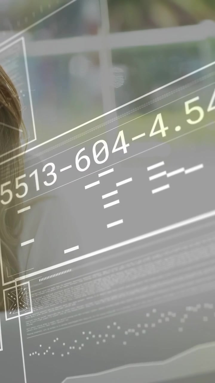Vertical video: Woman sitting by window while live data animating panels beside her for analytics