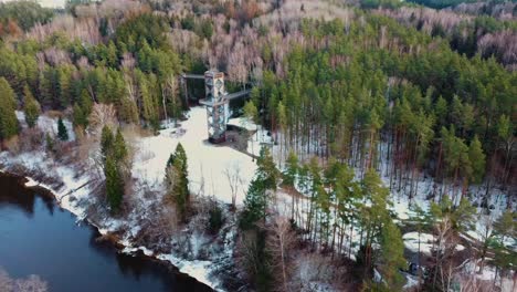 aerial view of anyksciai laju takas, treetop walking path complex with a walkway, an information center and observation tower, located in anyksciai, lithuania near sventoji river