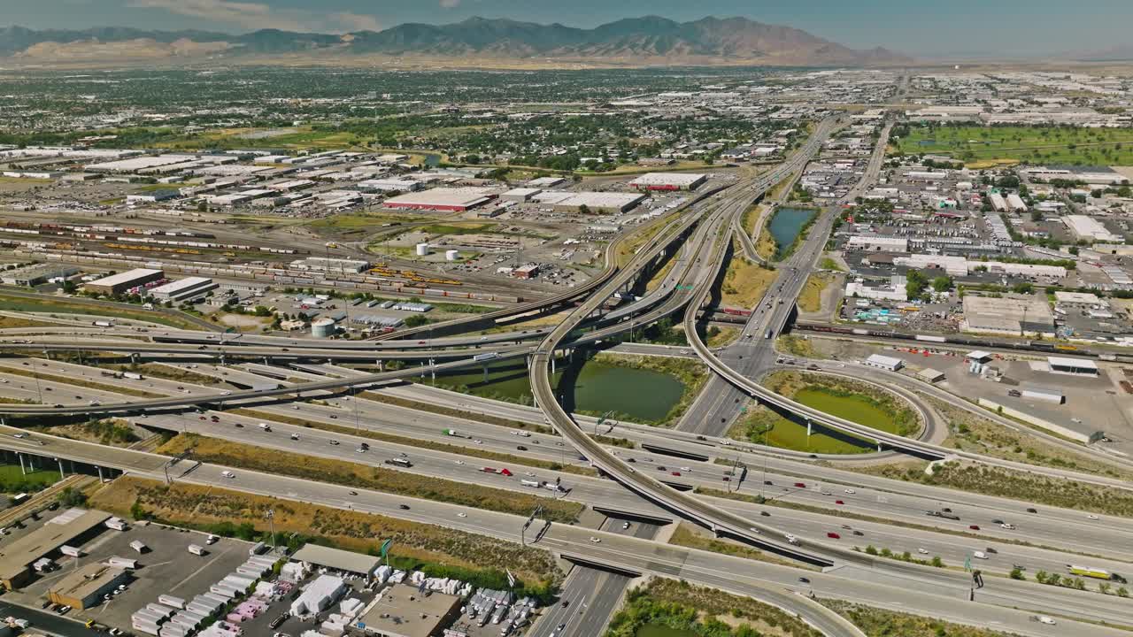 Traffic crossing on complex highway with downtown cityscape