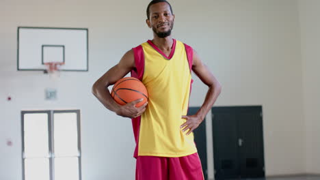 african american man poses confidently in a gym, with copy space