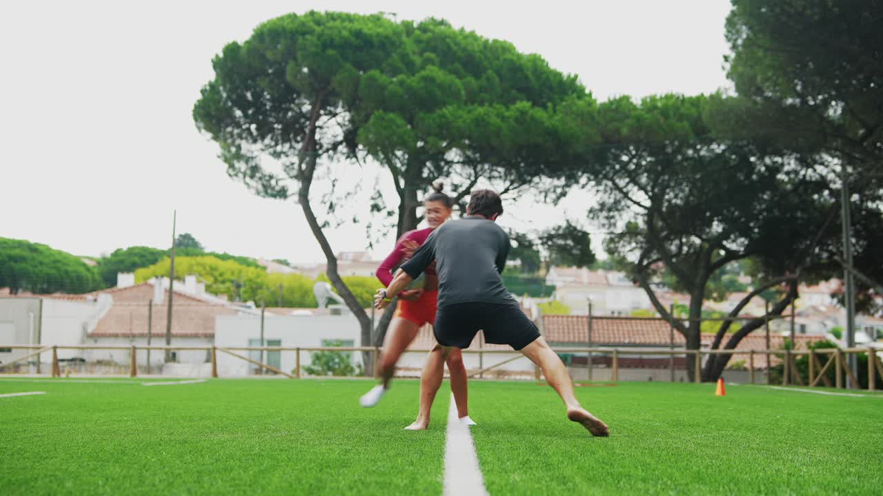 People playing sports on a grassy field
