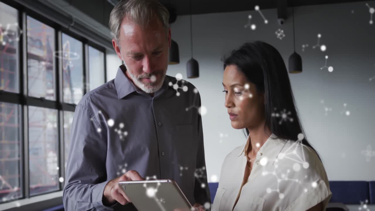 Animation of molecular structures floating against diverse man and woman discussing at office