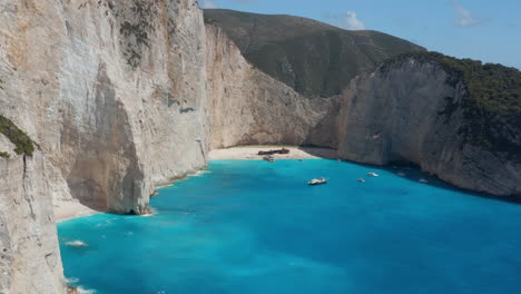 shipwreck on the pristine beach of navagio in a secluded greek cove in zakynthos island, greece