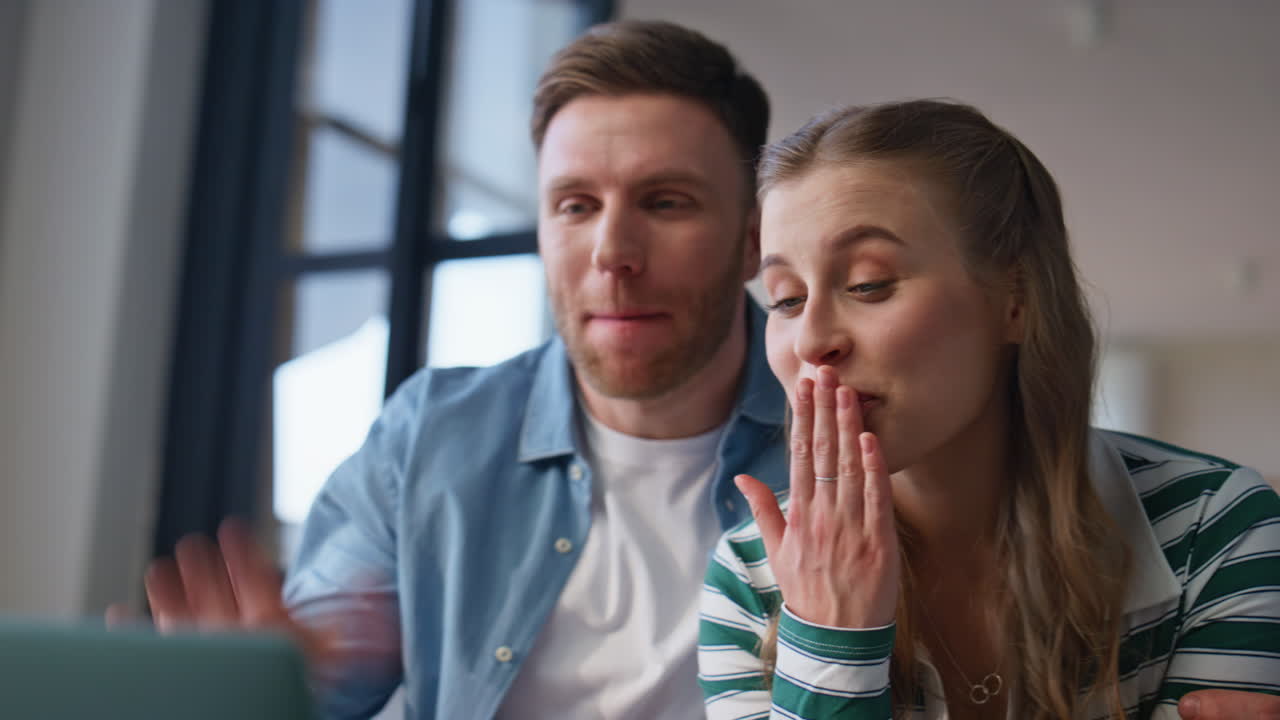 Tender couple talking web camera looking laptop at home closeup. Happy spouses