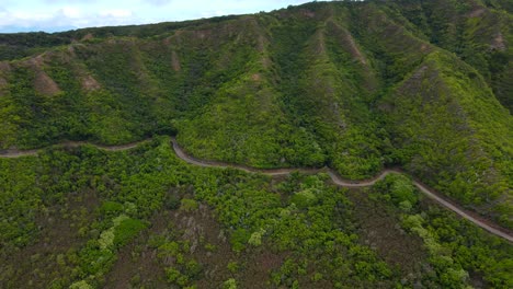 aerial zoom in on huge mountain in molokai hawaii