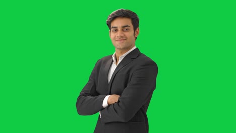 Successful-Indian-businessman-standing-crossed-hands-Green-screen