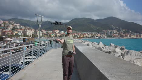 Drone-Pilot-Carefully-Landing-DJI-Mavic-3-Pro-In-His-hand-Beside-Breakwater