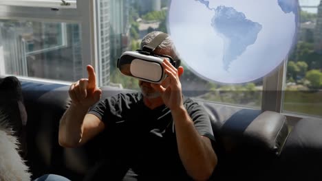 Animation-of-globe-spinning-over-man-using-vr-headset