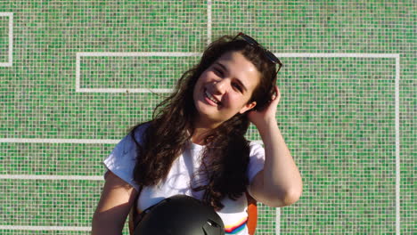 young female skater removing her helmet