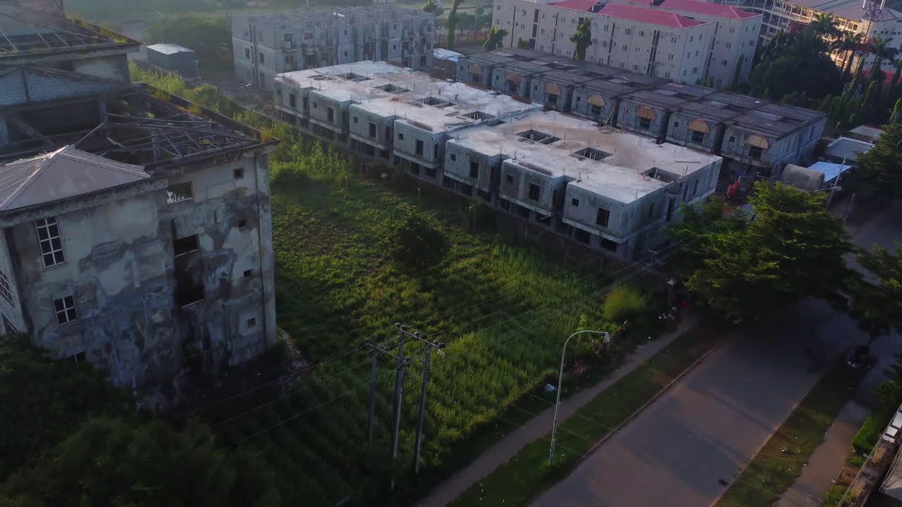 Aerial of a large construction site with homes and apartments buildings under development on a sunny day in Abuja, Nigeria, Africa