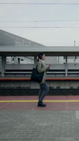 woman walking on train station platform