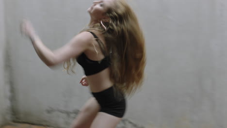 dancing woman talented young caucasian street dancer performing contemporary moves enjoying modern dance expression practicing in grungy warehouse close up