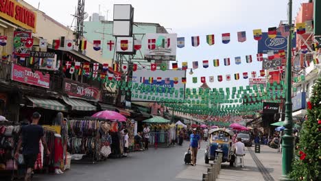 pedestrians and vendors at a vibrant street market