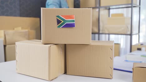 flag of south africa on a logistics cargo package.