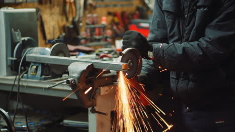 Angle-Grinder-Cutting-Metal-At-Workshop-29