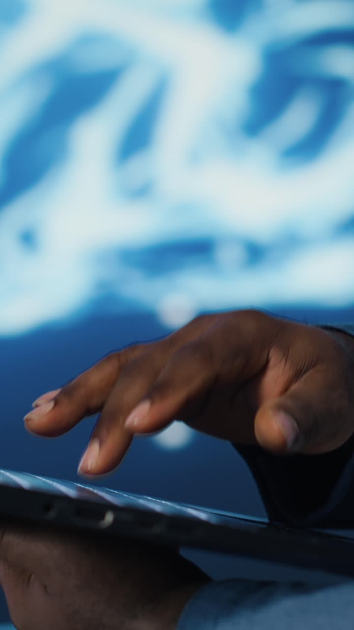 Close-up of Man's Hand Typing on Laptop Keyboard