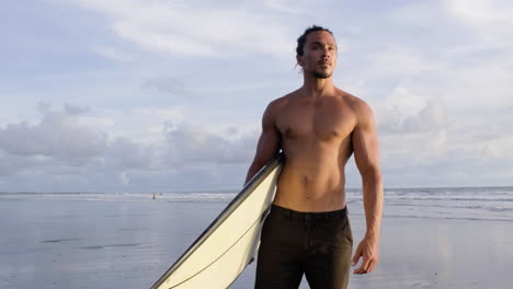 young man with surfboard