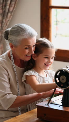 grandmother and granddaughter sewing
