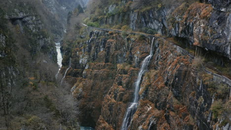 Drone-View-of-Beautiful-Water-Cascade-on-Mountain-Cliff