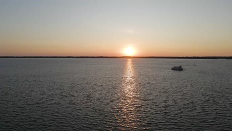 lake erie at sunset in erie pennsylvania ascending over water revealing horizon