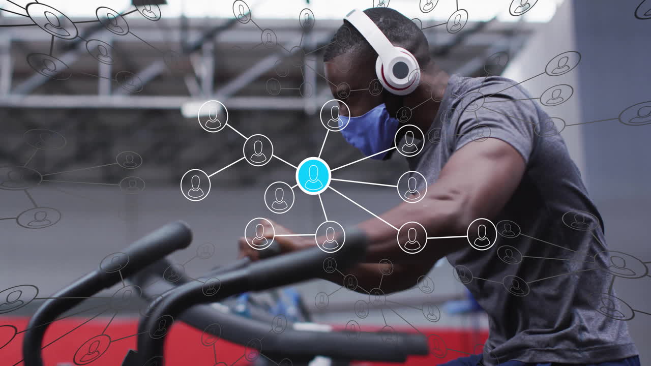 man leaning forward on cardio machine in modern gym, showcasing fitness network data overlay