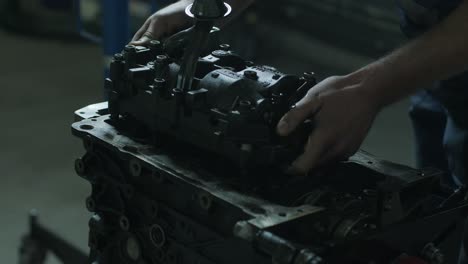 open car engine close-up. an auto mechanic in a garage repairing a car engine after removing a cover. car engine repair. car service