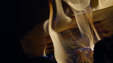 slow motion shot of flames and embers in a fireplace