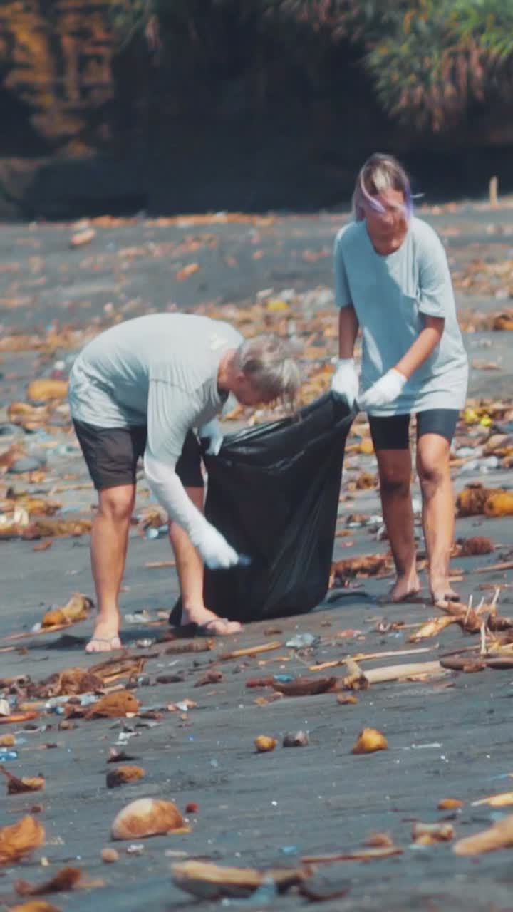 Volunteers clean up plastic waste on a beautiful bali beach