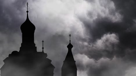 silhouette of church with storm and black clouds background