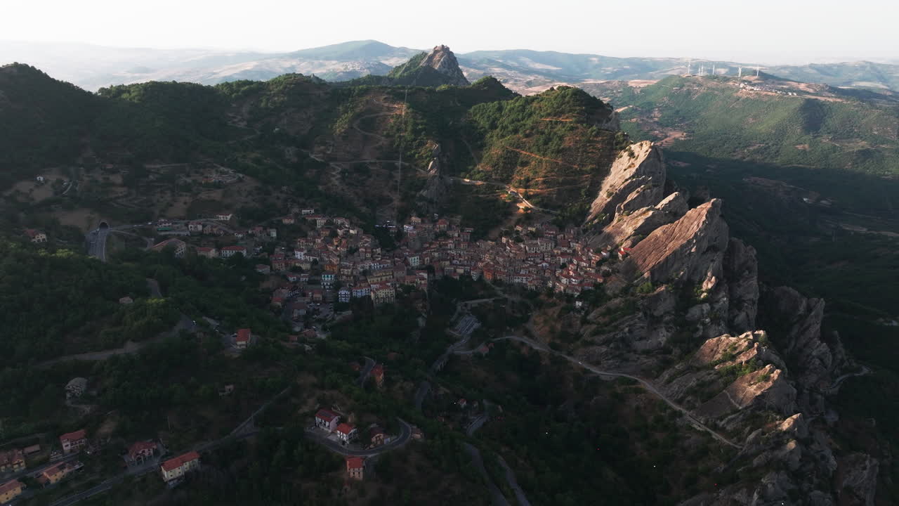 Drone footage of Castelmezzano, Italy. Picturesque mountain village with dramatic cliffs, historic charm and breathtaking views. Ideal for travel, tourism, destination and cultural stock footage
