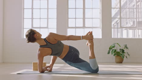 healthy yoga woman practicing low lunge quad stretch pose enjoying fitness lifestyle exercising in studio stretching beautiful body training on exercise mat at sunrise